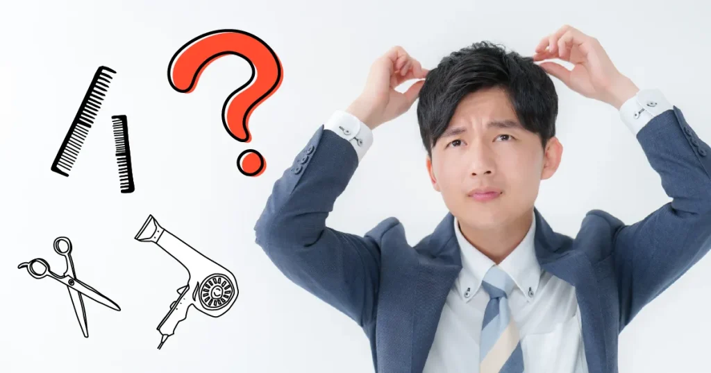 髪型に悩むスーツ姿の男性 - 面接にふさわしくない髪型のNG例を考える